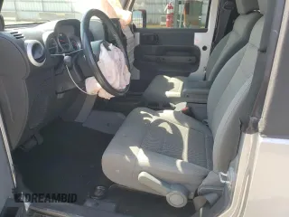 2009 Jeep Wrangler Sahara with VIN 1J4FA54119L747068, listed as a Copart auction lot 71209904 with 86,978 mi miles and Salvage title. Bid and sale history available at DreamBid. Image 7.