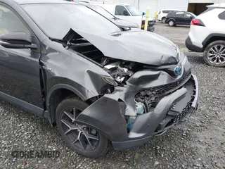 2018 Toyota RAV4 Hybrid SE with VIN JTMJJREV7JD208249, listed as a IAAI auction lot 41859301 with 91,899 mi miles and . Bid and sale history available at DreamBid. Image 6.