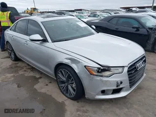 2015 Audi A6 2.0T Premium Plus with VIN WAUGFAFC8FN032627, listed as a IAAI auction lot 41270302 with 82,104 mi miles. Bid and sale history available at carsss.com. Image 1.