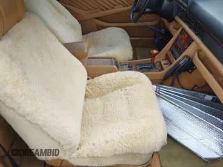 1990 Mercedes-Benz 560 with VIN WDBCA45E9LA549067, listed as a IAAI auction lot 41849642 with 124,516 mi miles and . Bid and sale history available at DreamBid. Image 5.