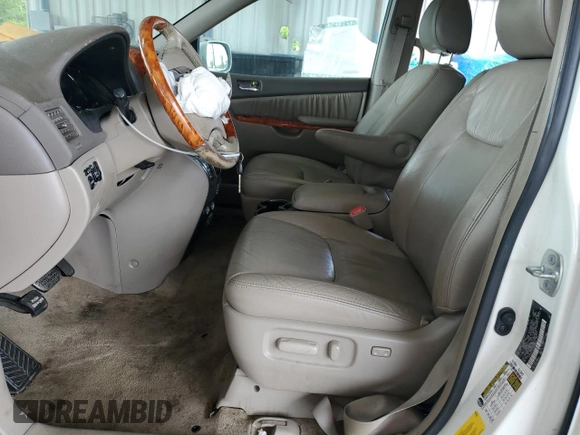 2010 Toyota Sienna XLE with VIN 5TDYK4CCXAS335064, listed as a Copart auction lot 62649665 with 246,327 mi miles and Salvage title. Bid and sale history available at DreamBid. Image 7.
