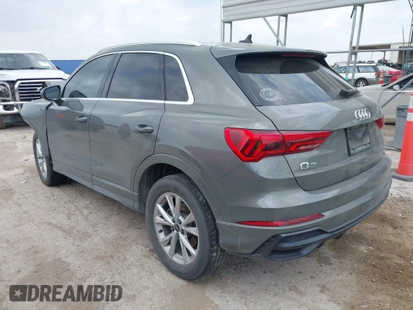 2021 Audi Q3 S line Premium z VIN WA1DECF33M1040282, wystawiony jako IAAI lot #42162587 z przebiegiem 90 509 mil mil oraz . Historia ofert i sprzedaży dostępna na DreamBid. Obrazek 3.