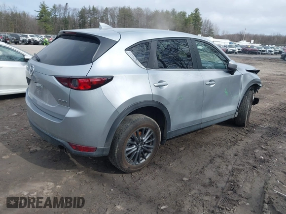 2021 Mazda CX-5 Touring with VIN JM3KFBCM9M1329806, listed as a IAAI auction lot 41825123 with 59,300 mi miles. Bid and sale history available at carsss.com. Image 4.
