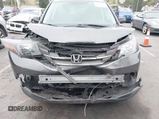 2014 Honda CR-V LX with VIN 3CZRM3H32EG715290, listed as a IAAI auction lot 42178372 with 90,934 mi miles and . Bid and sale history available at carsss.com. Image 6.