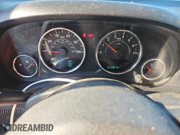2012 Jeep Wrangler Sport with VIN 1C4AJWAG5CL273292, listed as a Copart auction lot 60135395 with 123,874 mi miles and Salvage title. Bid and sale history available at DreamBid. Image 9.