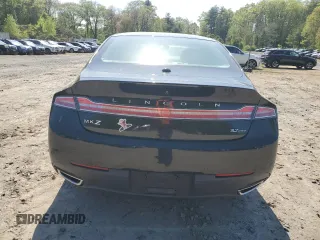 2014 Lincoln MKZ z VIN 3LN6L2JK4ER805421, wystawiony jako Copart lot #56781605 z przebiegiem 90 061 mil mil oraz Tytuł czysty. Historia ofert i sprzedaży dostępna na DreamBid. Obrazek 6.