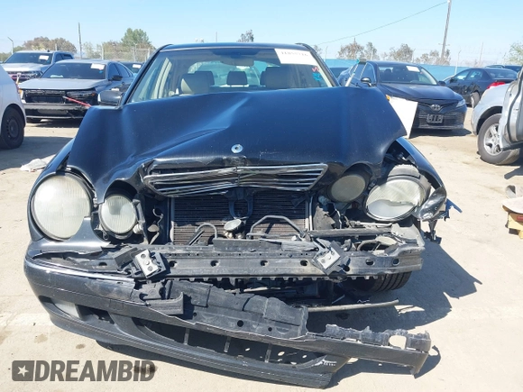 2001 Mercedes-Benz E-Class with VIN WDBJF65J11B368277, listed as a IAAI auction lot 41855716 with 207,864 mi miles. Bid and sale history available at carsss.com. Image 12.