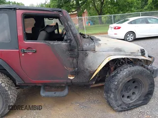 2012 Jeep Wrangler Sport with VIN 1C4AJWAG9CL203018, listed as a IAAI auction lot 42377899 with Not provided miles and . Bid and sale history available at DreamBid. Image 16.