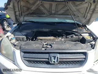 2005 Honda Pilot EX-L with NAVI with VIN 2HKYF18775H571312, listed as a IAAI auction lot 41830609 with 297,923 mi miles. Bid and sale history available at carsss.com. Image 10.
