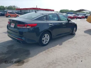 2016 Kia Optima LX with VIN KNAGT4L37G5073752, listed as a IAAI auction lot 42132621 with 136,818 mi miles. Bid and sale history available at carsss.com. Image 4.