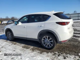 2021 Mazda CX-5 Grand Touring with VIN JM3KFBDM3M1305807, listed as a Copart auction lot 42713655 with 58,162 mi miles and Salvage Title. Bid and sale history available at DreamBid. Image 2.