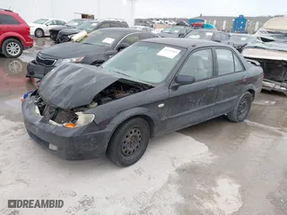 2002 Mazda Protege DX with VIN JM1BJ225821606816, listed as a IAAI auction lot 41365353 with 118,648 mi miles. Bid and sale history available at carsss.com. Image 18.