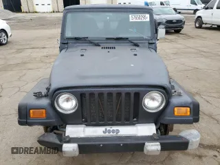 2002 Jeep Wrangler Sport z VIN 1J4FA49S22P763189, wystawiony jako Copart lot #57650295 z przebiegiem 197 383 mil mil oraz Czysty tytuł • Clean title. Historia ofert i sprzedaży dostępna na DreamBid. Obrazek 5.