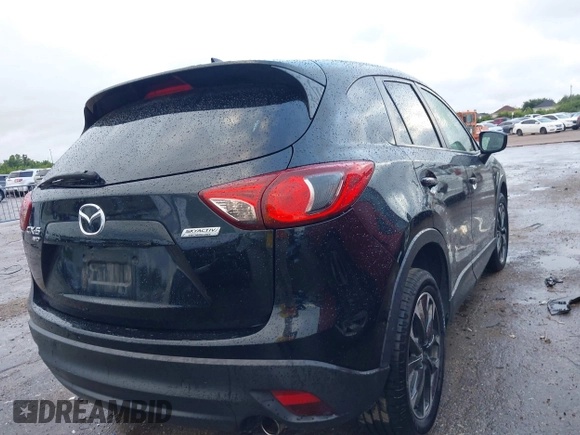 2016 Mazda CX-5 Grand Touring z VIN JM3KE4DY9G0605489, wystawiony jako IAAI lot #42085160 z przebiegiem 160 338 mil mil oraz . Historia ofert i sprzedaży dostępna na DreamBid. Obrazek 4.