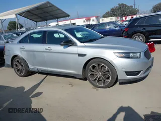 2014 Ford Taurus SHO with VIN 1FAHP2KT8EG123342, listed as a IAAI auction lot 42095390 with 142,957 mi miles. Bid and sale history available at carsss.com. Image 13.