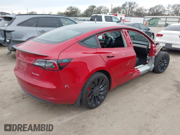 2022 Tesla Model 3 Performance with VIN 5YJ3E1ECXNF329188, listed as a IAAI auction lot 41308371 with 15,220 mi miles and . Bid and sale history available at DreamBid. Image 4.