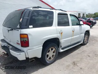 2002 GMC Yukon Denali z VIN 1GKEK63UX2J216442, wystawiony jako IAAI lot #42391575 z przebiegiem 122 668 mil mil oraz . Historia ofert i sprzedaży dostępna na DreamBid. Obrazek 4.