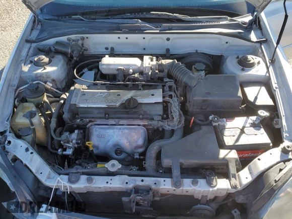 2003 Hyundai Accent GL z VIN KMHCG45C63U413388, wystawiony jako Copart lot #88979235 z przebiegiem 240 928 mil mil oraz Szkoda całkowita • Salvage title. Historia ofert i sprzedaży dostępna na DreamBid. Obrazek 11.