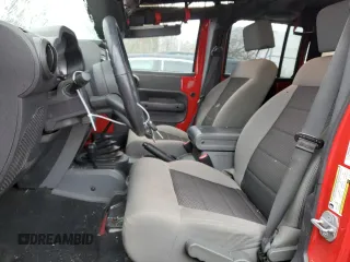 2010 Jeep Wrangler Unlimited Rubicon with VIN 1J4BA6H17AL109880, listed as a Copart auction lot 44205455 with 95,781 mi miles and Salvage title. Bid and sale history available at DreamBid. Image 7.