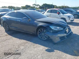 2014 Tesla Model S 60 with VIN 5YJSA1H1XEFP31911, listed as a IAAI auction lot 42029215 with Not Provided miles and . Bid and sale history available at DreamBid. Image 1.