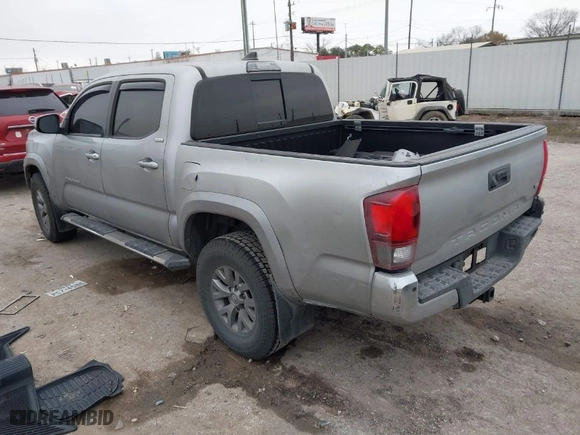 2018 Toyota Tacoma SR5 with VIN 3TMAZ5CN7JM053453, listed as a IAAI auction lot 41430111 with 128,149 mi miles. Bid and sale history available at carsss.com. Image 3.