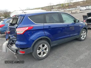 2015 Ford Escape SE with VIN 1FMCU9GX4FUC73125, listed as a IAAI auction lot 42071815 with 71,681 mi miles. Bid and sale history available at carsss.com. Image 4.