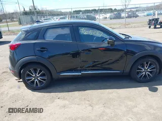 2018 Mazda CX-3 Grand Touring z VIN JM1DKFD75J0312662, wystawiony jako IAAI lot #41805287 z przebiegiem 140 083 mil mil oraz . Historia ofert i sprzedaży dostępna na DreamBid. Obrazek 13.