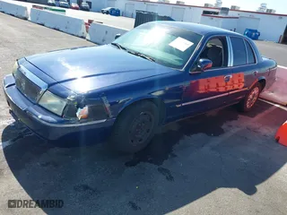 2004 Mercury Grand Marquis GS with VIN 2MEFM74W94X632233, listed as a IAAI auction lot 42051360 with 167,654 mi miles. Bid and sale history available at carsss.com. Image 2.