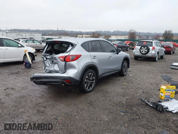 2016 Mazda CX-5 Grand Touring with VIN JM3KE4DY4G0712465, listed as a IAAI auction lot 41859217 with 61,806 mi miles and . Bid and sale history available at carsss.com. Image 4.
