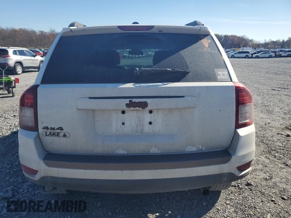 2017 Jeep Compass 75th Anniversary Edition with VIN 1C4NJDBBXHD168127, listed as a Copart auction lot 77858624 with 82,702 mi miles and Salvage Title. Bid and sale history available at carsss.com. Image 6.