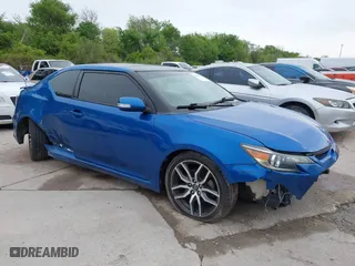 2014 Scion tC with VIN JTKJF5C77E3081277, listed as a IAAI auction lot 41932581 with 135,556 mi miles. Bid and sale history available at carsss.com. Image 14.