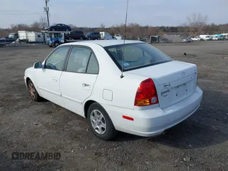 2004 Hyundai Accent GL with VIN KMHCG45C64U539526, listed as a IAAI auction lot 41199434 with 81,442 mi miles. Bid and sale history available at carsss.com. Image 3.