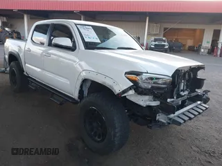 2023 Toyota Tacoma SR5 z VIN 3TMAZ5CN2PM201937, wystawiony jako IAAI lot #42142638 z przebiegiem 61 340 mil mil oraz . Historia ofert i sprzedaży dostępna na DreamBid. Obrazek 1.