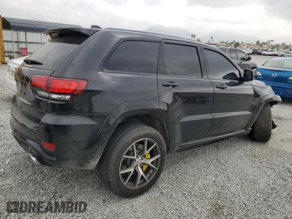 2017 Jeep Grand Cherokee SRT with VIN 1C4RJFDJ1HC904654, listed as a Copart auction lot 55954124 with 82,507 mi miles and Salvage Title. Bid and sale history available at carsss.com. Image 3.