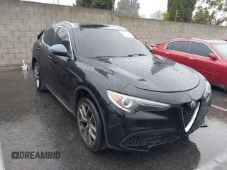 2018 Alfa Romeo Stelvio z VIN ZASFAKANXJ7C23921, wystawiony jako IAAI lot #38783836 z przebiegiem 93 482 mil mil oraz . Historia ofert i sprzedaży dostępna na DreamBid. Obrazek 1.