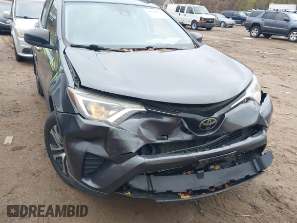 2017 Toyota RAV4 LE with VIN JTMBFREV3HJ704411, listed as a IAAI auction lot 40868831 with 102,729 mi miles. Bid and sale history available at carsss.com. Image 6.
