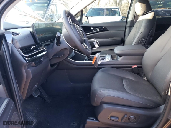 2025 Kia Carnival SX with VIN KNDNE5K39S6459121, listed as a Copart auction lot 85050024 with 0 mi miles and Salvage Title. Bid and sale history available at carsss.com. Image 7.