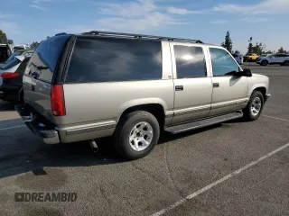 1999 GMC Suburban with VIN 3GKEC16R0XG526194, listed as a Copart auction lot 83740634 with 199,583 mi miles and Clean title. Bid and sale history available at DreamBid. Image 3.