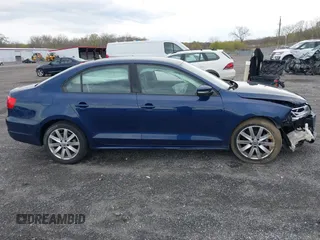 2014 Volkswagen Jetta SE z VIN 3VWD17AJ8EM326015, wystawiony jako IAAI lot #42027359 z przebiegiem 75 436 mil mil oraz . Historia ofert i sprzedaży dostępna na DreamBid. Obrazek 13.