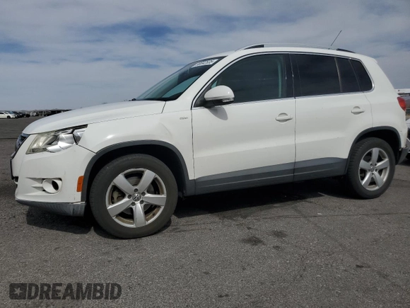 2010 Volkswagen Tiguan Wolfsburg Edition with VIN WVGAV7AX7AW003188, listed as a Copart auction lot 56692535 with 121,502 mi miles and Salvage title. Bid and sale history available at DreamBid. Image 1.