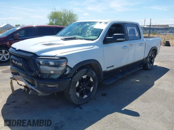 2022 Ram 1500 Rebel z VIN 1C6SRFLT4NN357352, wystawiony jako IAAI lot #41881613 z przebiegiem 31 285 mil mil oraz . Historia ofert i sprzedaży dostępna na DreamBid. Obrazek 16.