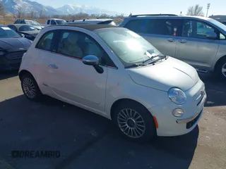2012 FIAT 500 Lounge z VIN 3C3CFFER7CT119147, wystawiony jako IAAI lot #41431509 z przebiegiem 140 084 mil mil oraz . Historia ofert i sprzedaży dostępna na DreamBid. Obrazek 1.