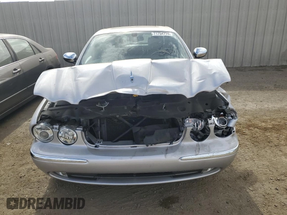 2004 Jaguar XJ with VIN SAJEA74C34SG09548, listed as a Copart auction lot 71754774 with 142,804 mi miles and Salvage Title. Bid and sale history available at DreamBid. Image 5.