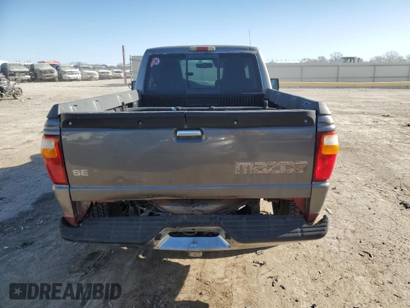 1999 Mazda B-Series Truck SX z VIN 4F4YR12C5XTM24067, wystawiony jako Copart lot #85241964 z przebiegiem 219 030 mil mil oraz Szkoda całkowita • Salvage title. Historia ofert i sprzedaży dostępna na DreamBid. Obrazek 6.