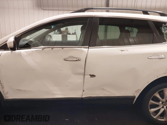 2014 Mazda CX-9 Grand Touring with VIN JM3TB3DA7E0428187, listed as a IAAI auction lot 41247569 with 117,590 mi miles and . Bid and sale history available at DreamBid. Image 15.