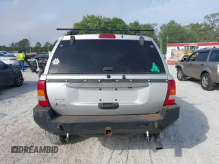 2003 Jeep Grand Cherokee Laredo z VIN 1J8GW48S33C519680, wystawiony jako IAAI lot #42126714 z przebiegiem 295 517 mil mil oraz . Historia ofert i sprzedaży dostępna na DreamBid. Obrazek 16.