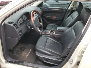2009 Chrysler 300 Limited with VIN 2C3KA33V39H590917, listed as a Copart auction lot 77657054 with 180,613 mi miles and Clean Title. Bid and sale history available at carsss.com. Image 7.
