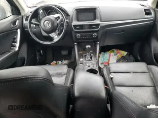 2016 Mazda CX-5 Grand Touring z VIN JM3KE2DY9G0687261, wystawiony jako Copart lot #52865415 z przebiegiem Nie podano mil oraz Szkoda całkowita • Salvage title. Historia ofert i sprzedaży dostępna na DreamBid. Obrazek 8.