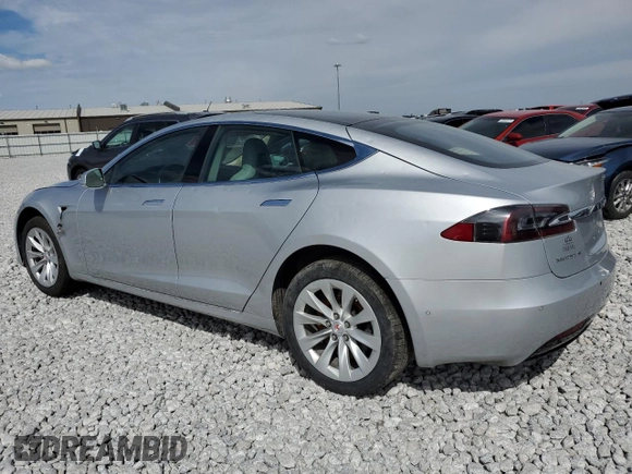 2016 Tesla Model S 90D with VIN 5YJSA1E25GF142104, listed as a Copart auction lot 50874815 with 84,917 mi miles and Salvage Title. Bid and sale history available at DreamBid. Image 2.