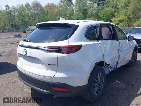 2021 Mazda CX-9 Touring z VIN JM3TCBCYXM0521323, wystawiony jako IAAI lot #42190976 z przebiegiem 56 652 mil mil oraz . Historia ofert i sprzedaży dostępna na DreamBid. Obrazek 4.